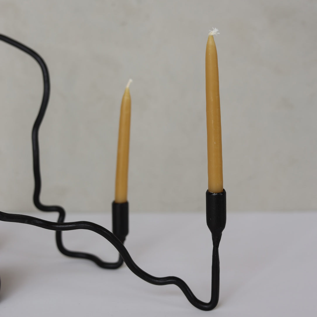BENT IRON CANDLESTICK