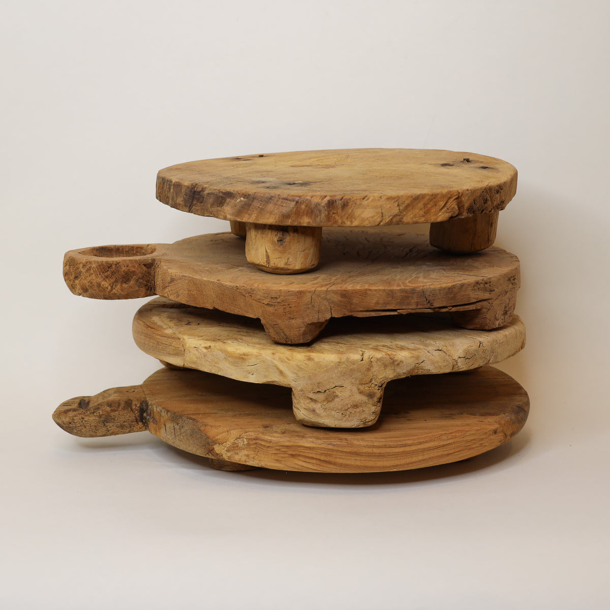 Stack of wooden trays on a white background