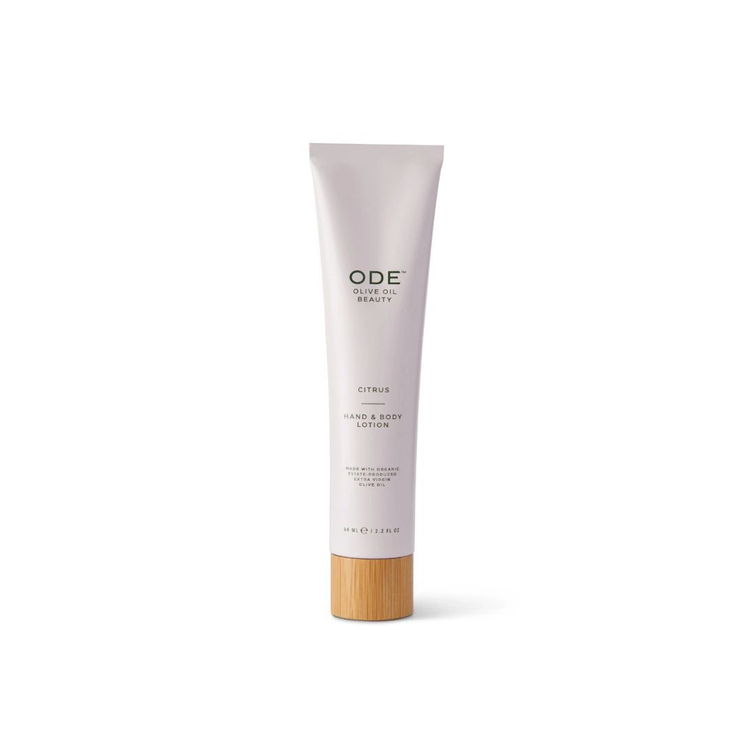Tube of ODE hand and body lotion with a bamboo cap on a white background