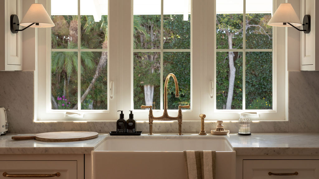 Beautifully decorated kitchen sink with large window