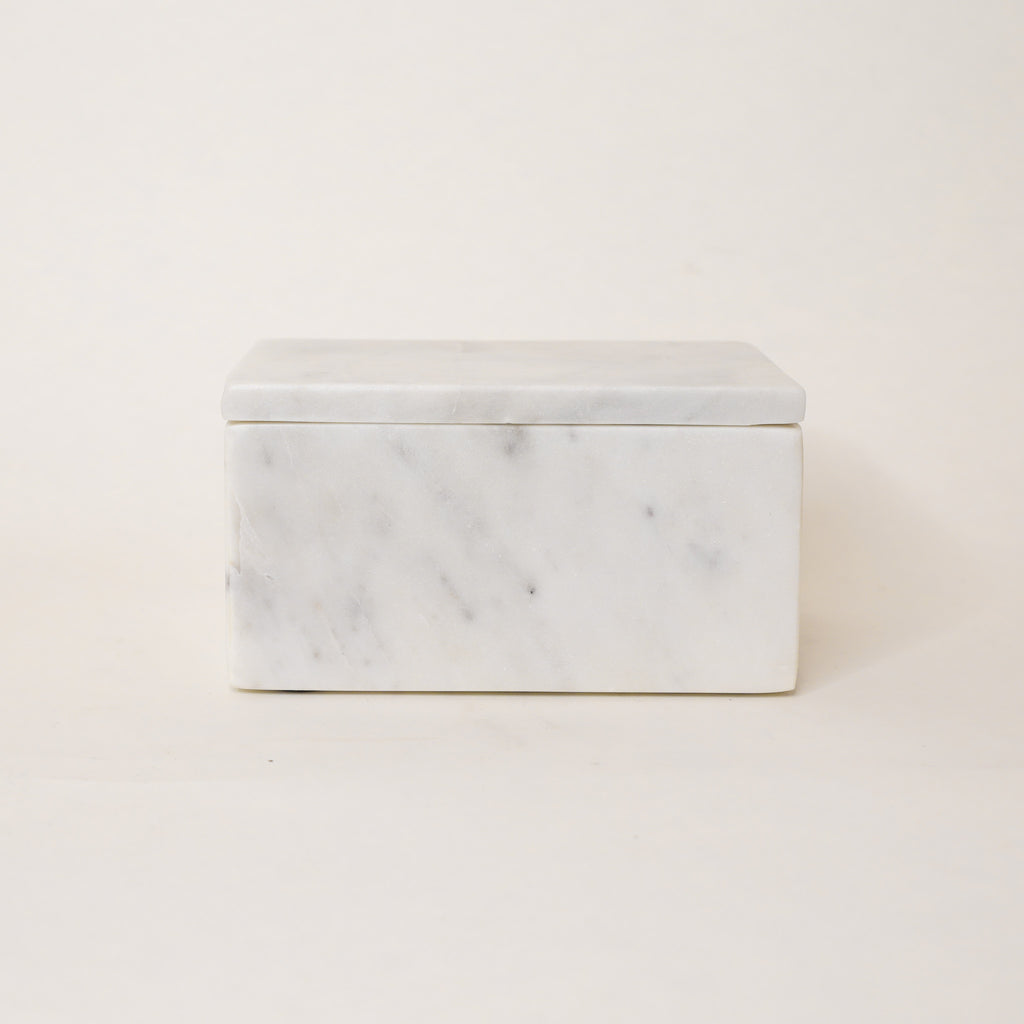 Marble-patterned rectangular box on a light beige background