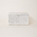 Marble-patterned rectangular box on a light beige background
