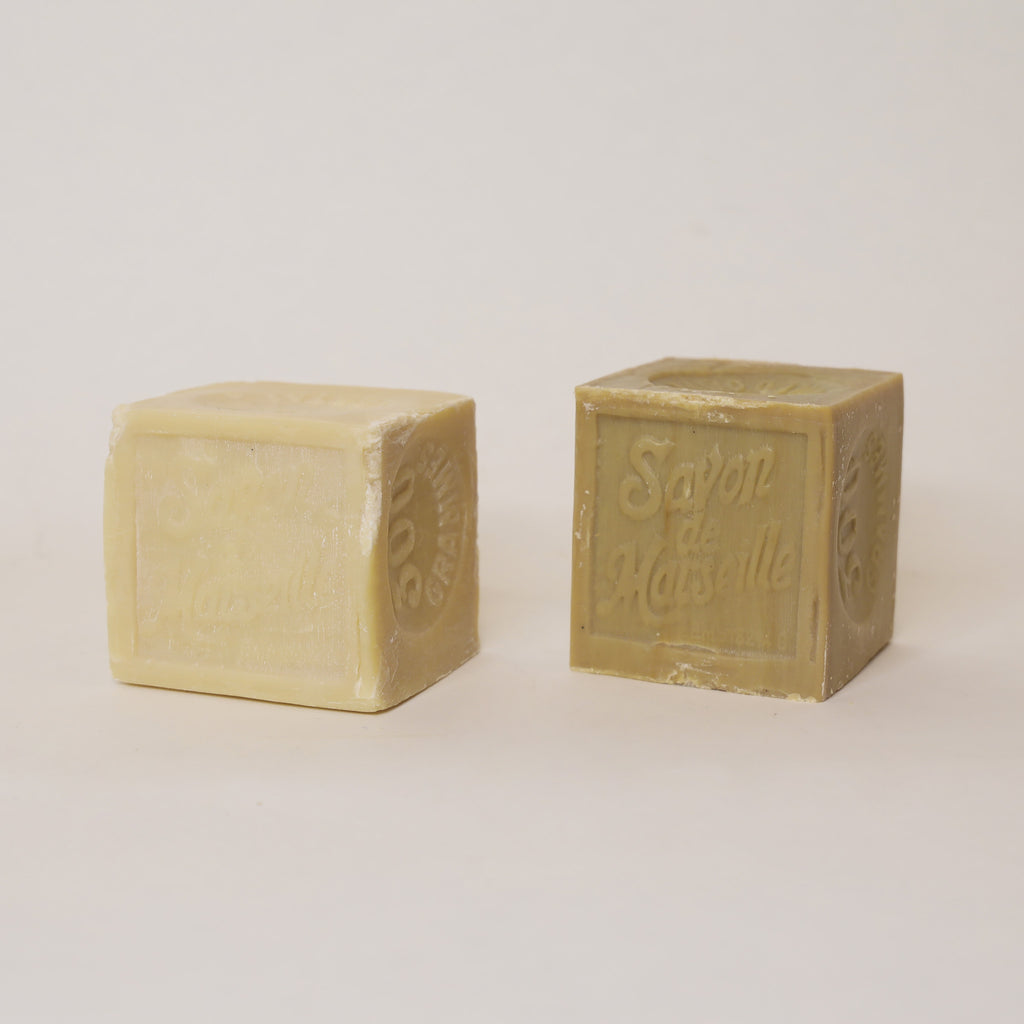 Two cubes of soap with 'Soap & Co.' branding on a light background