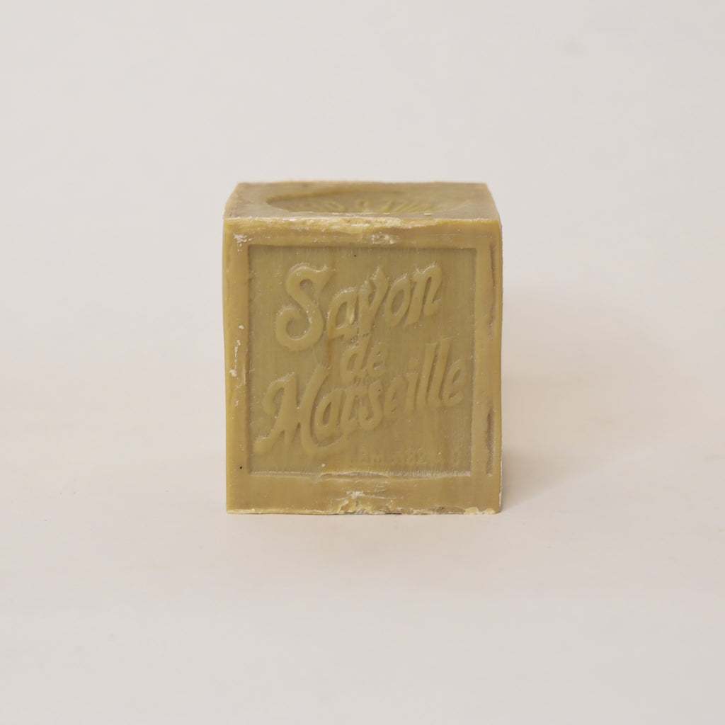 Bar of soap with 'Savon de Marseille' text on a light background