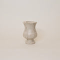 Beige marble vase  on a plain background