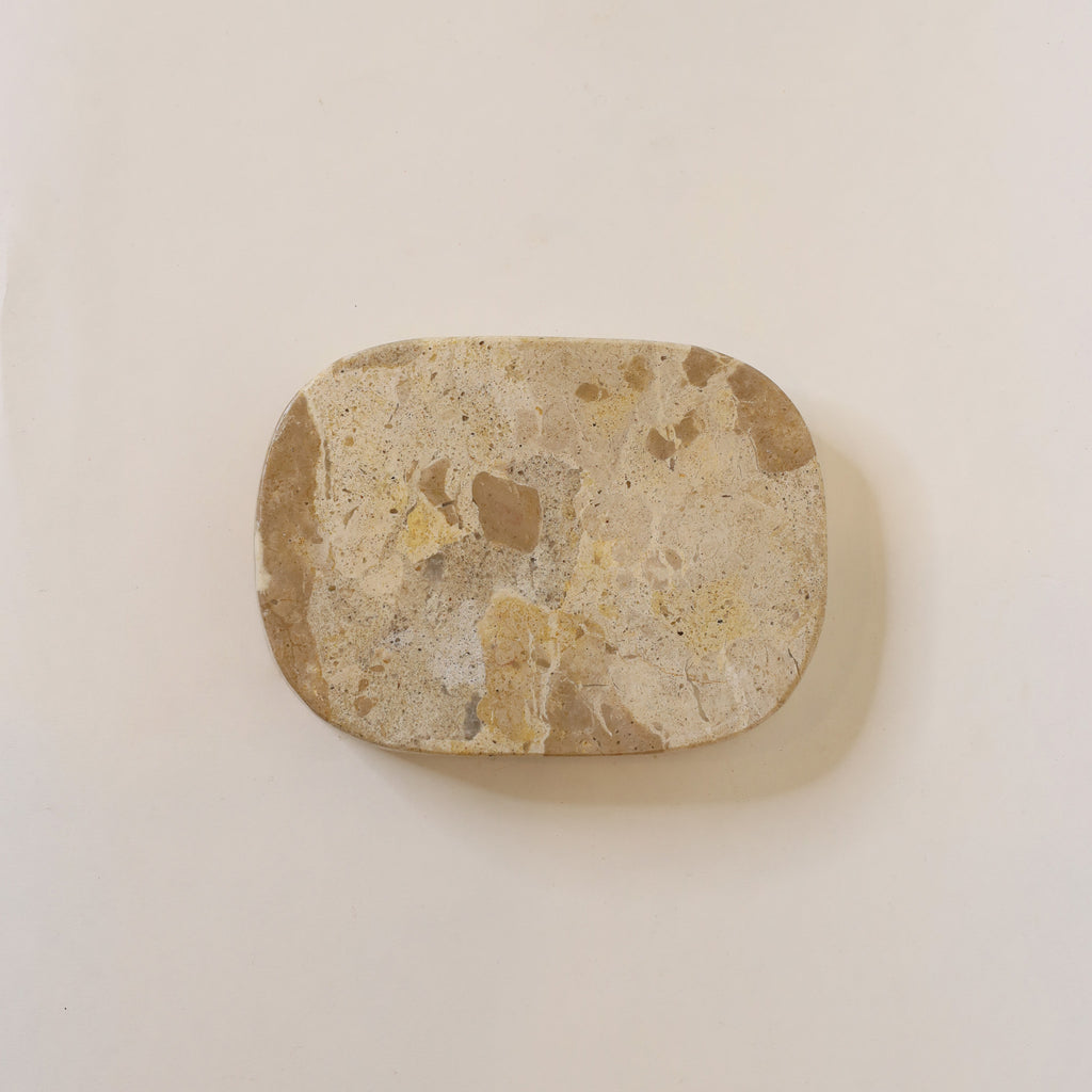 Brown stone on a beige background