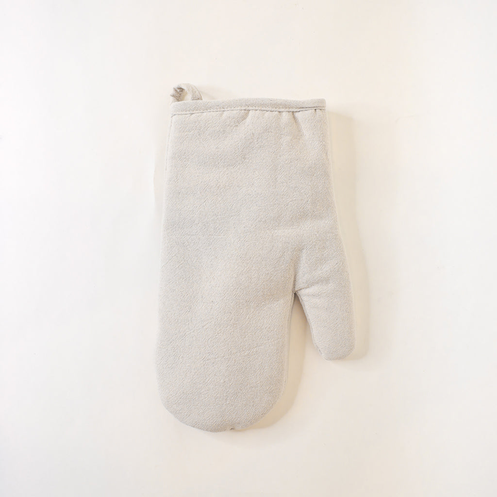 Beige oven mitt on a white background