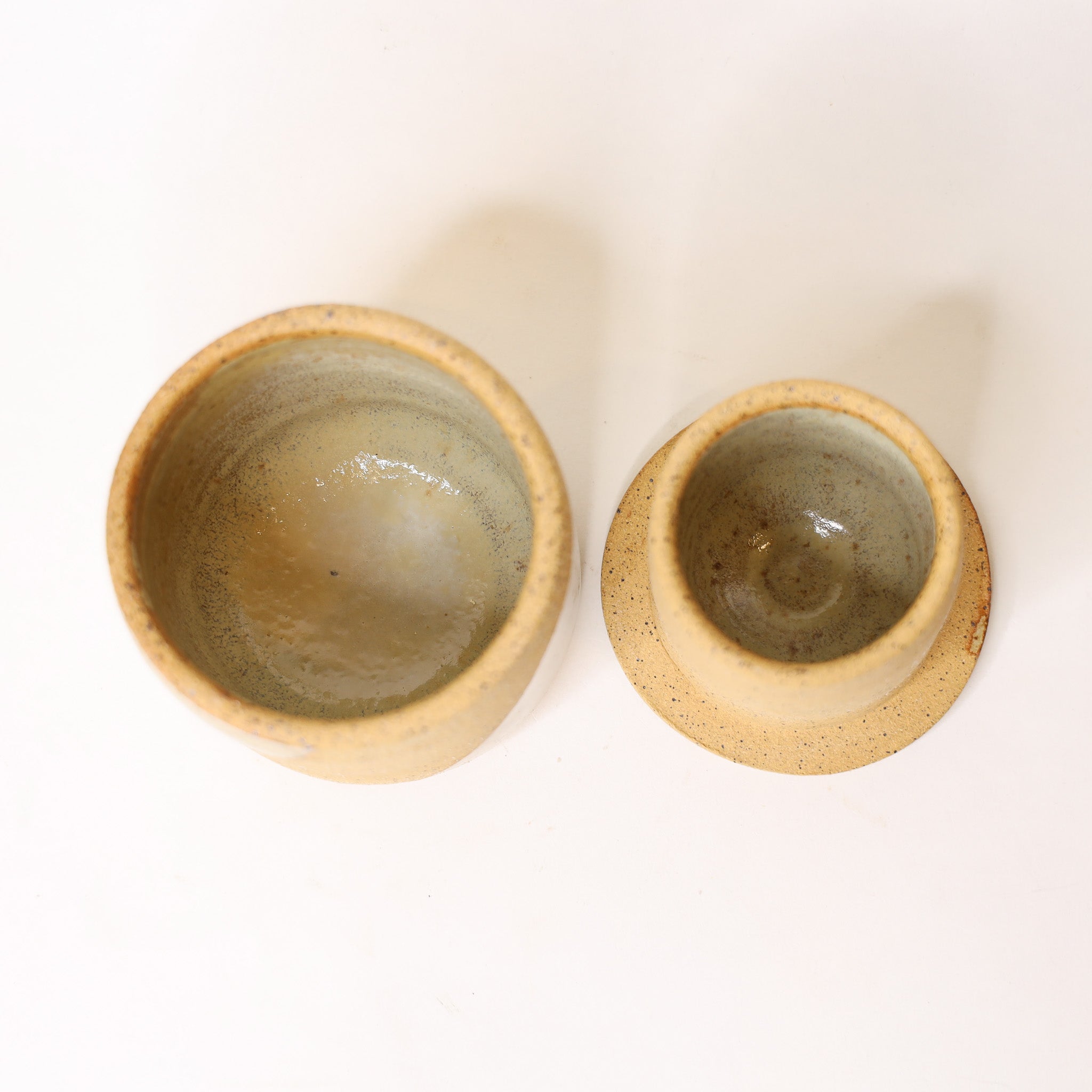 Two ceramic bowls with a textured surface on a white background