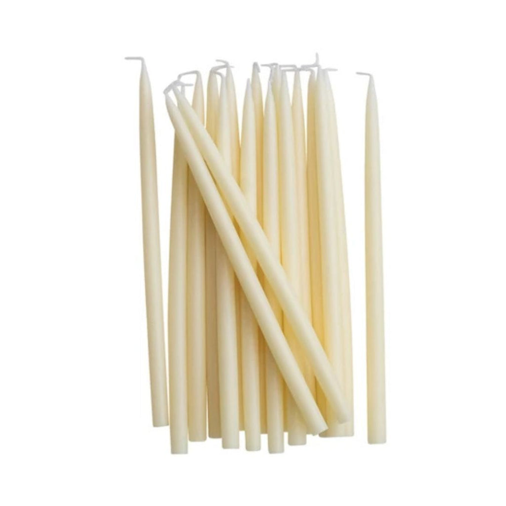 Set of white candles on a white background